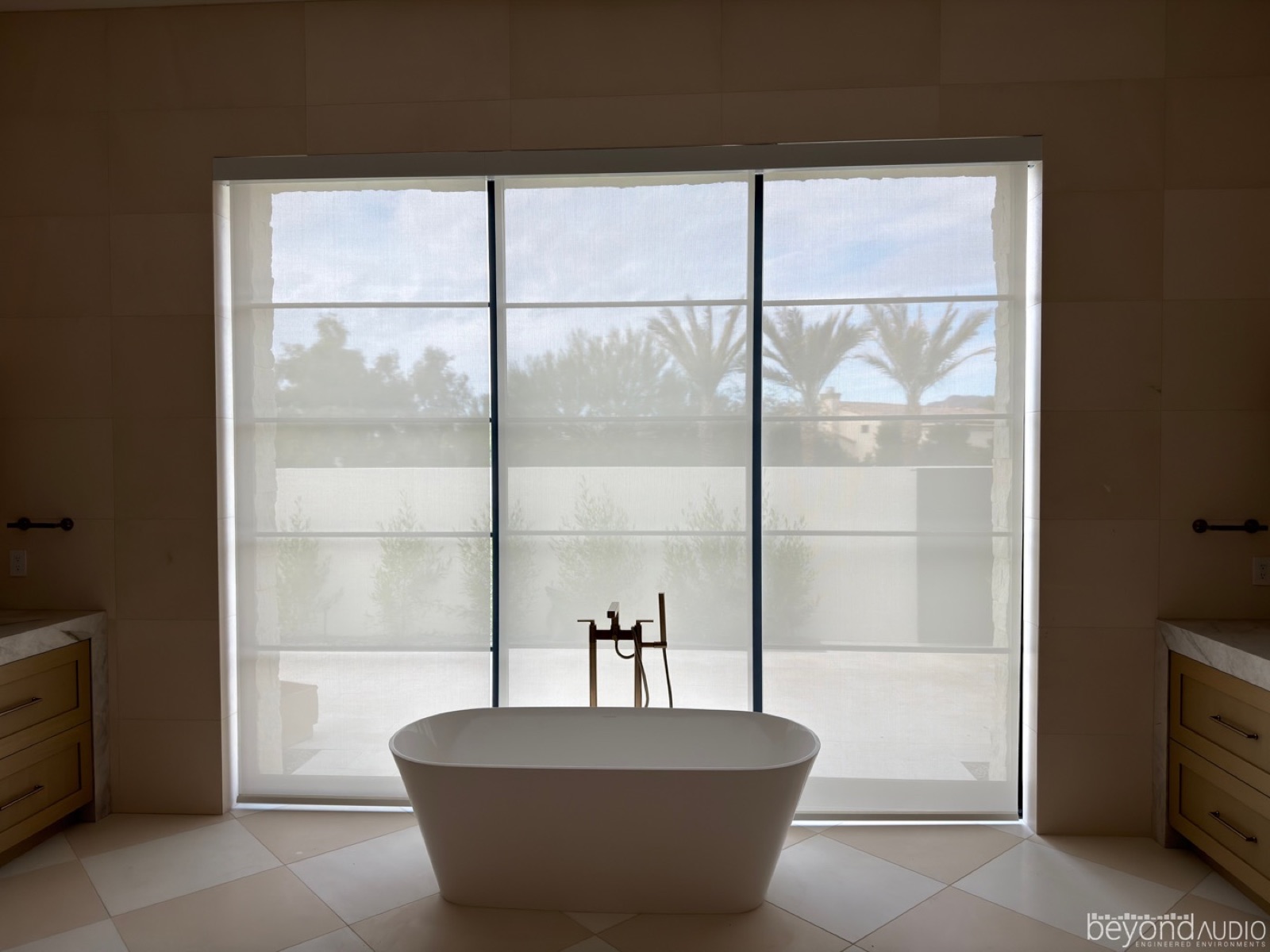Motorized sheer shades in a luxury bath